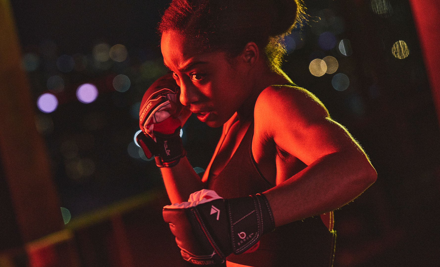 woman wearing mma gloves from century martial arts