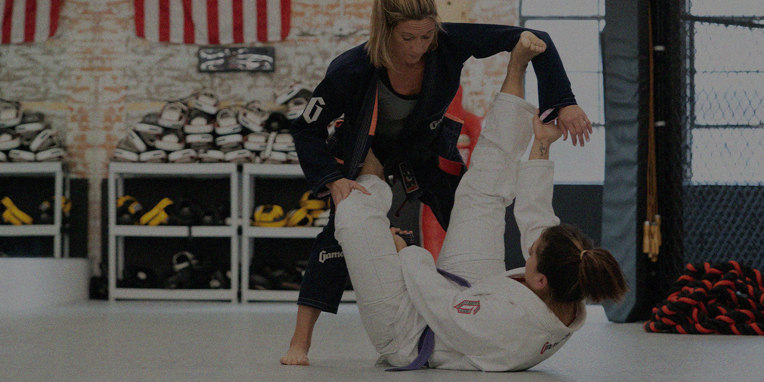 martial artists training on mats
