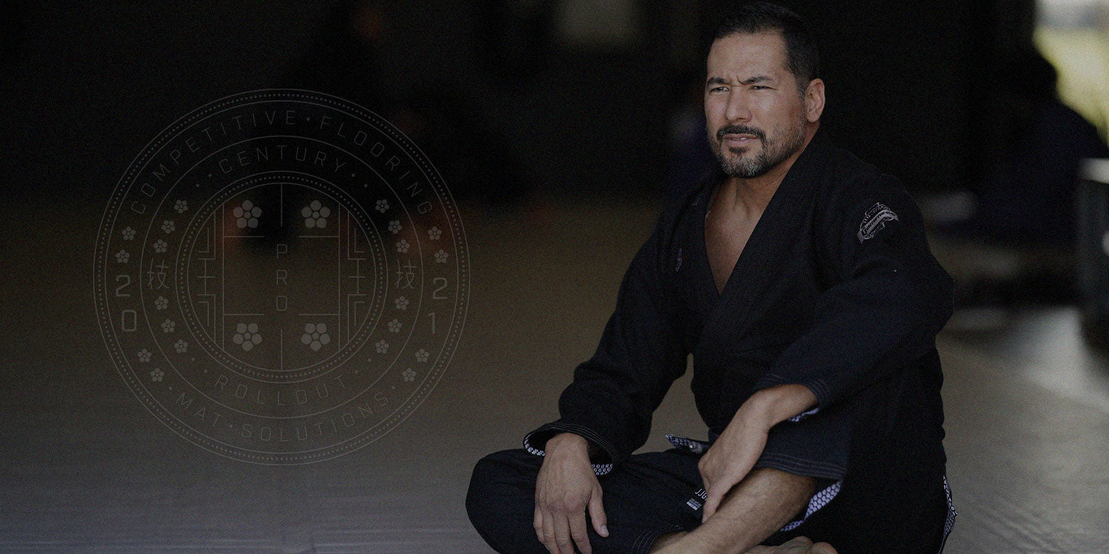 martial artist sitting on mats