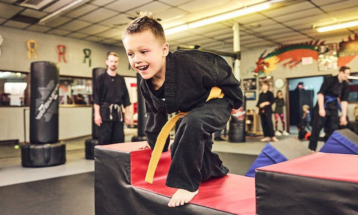 Young martial artist training on obstacle course