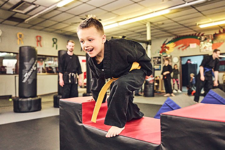 Young martial artist training on obstacle course