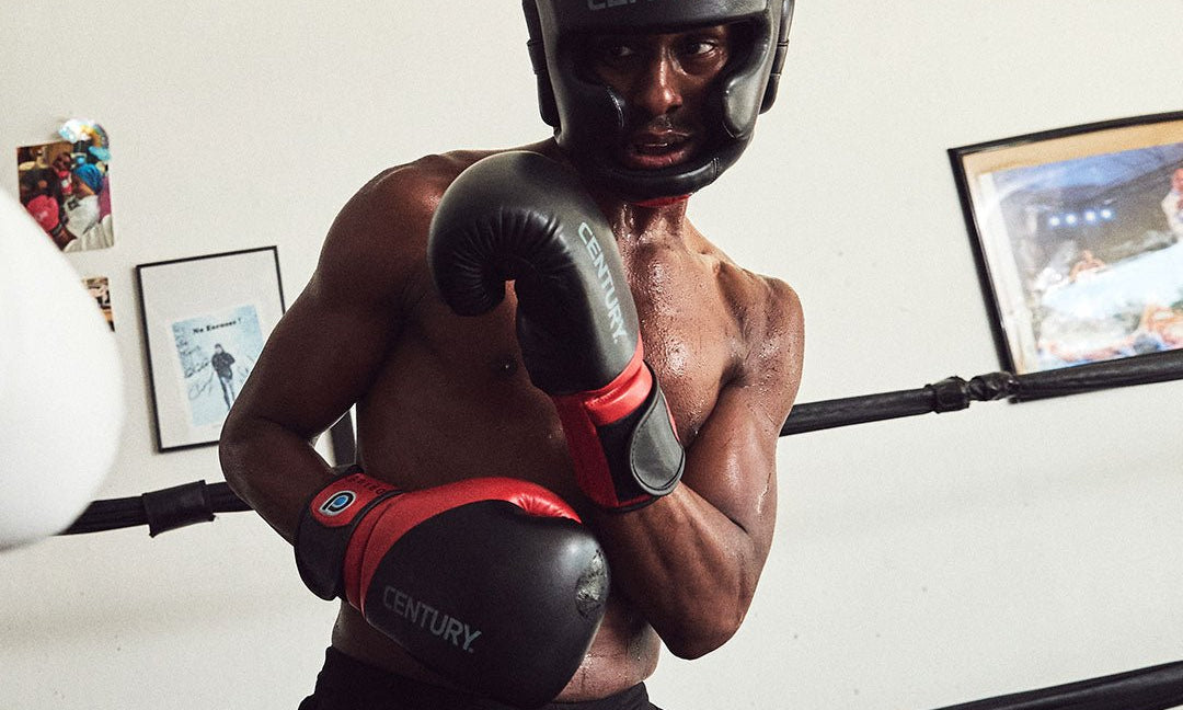 Boxer in Century headgear in the ring