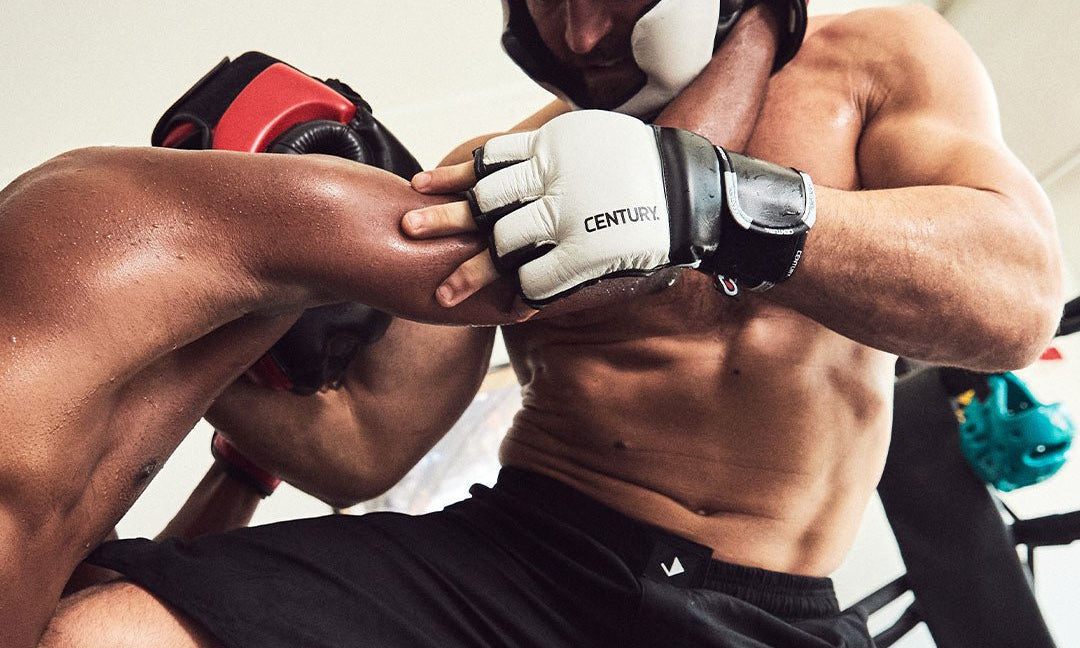 MMA fighters training in Century headgear and MMA gloves