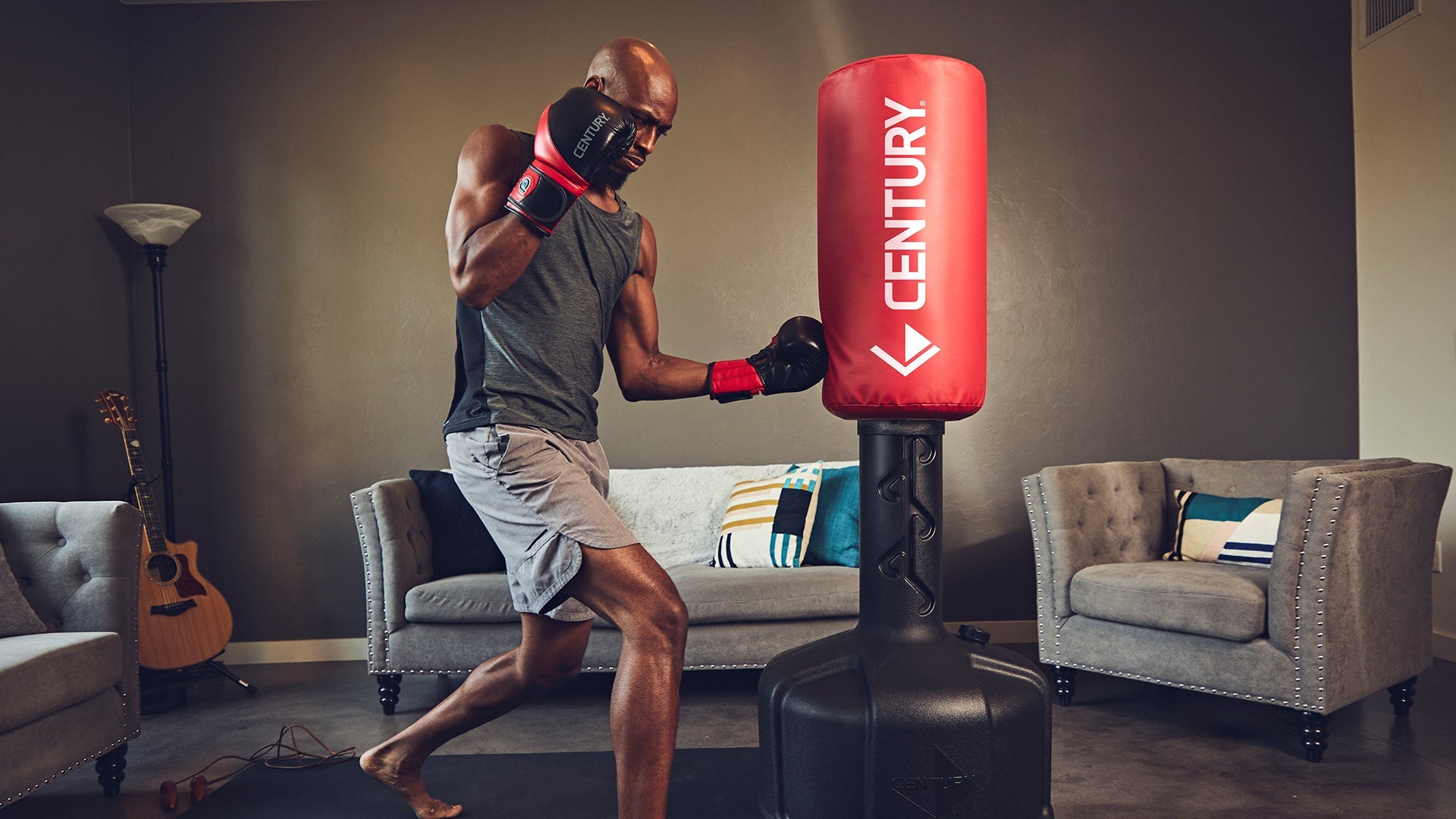 Punching Bags - Century Martial Arts, man kicking century ghost wavemaster