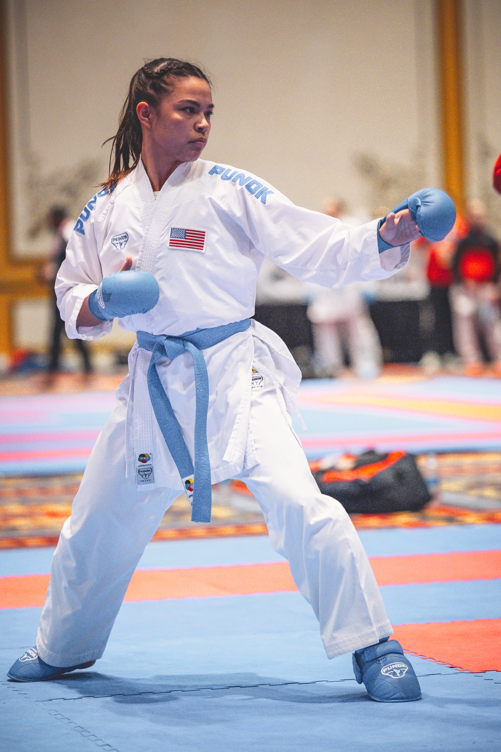 competitor poised to fight in punok gi with blue details