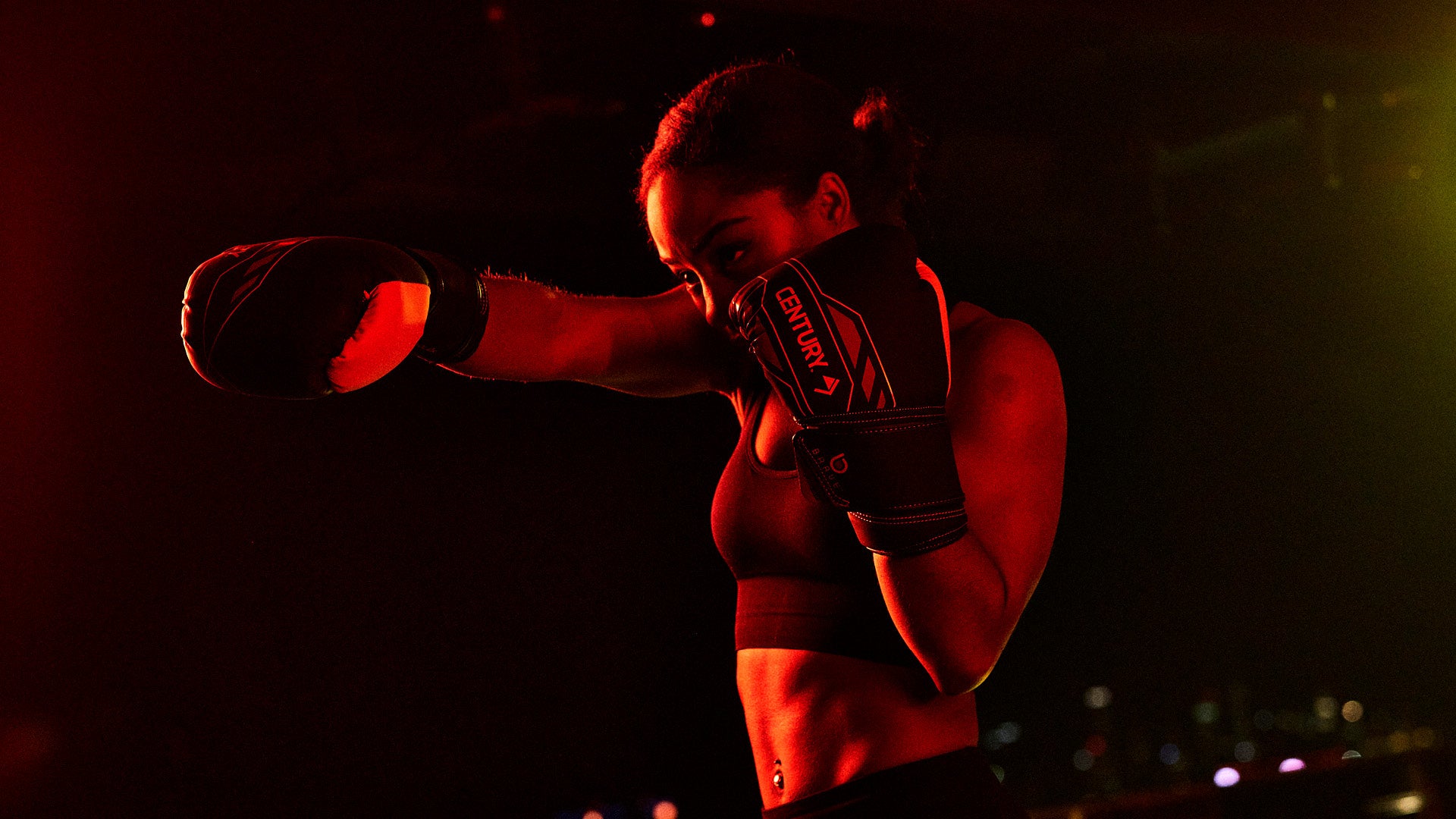 female athlete wearing century gloves