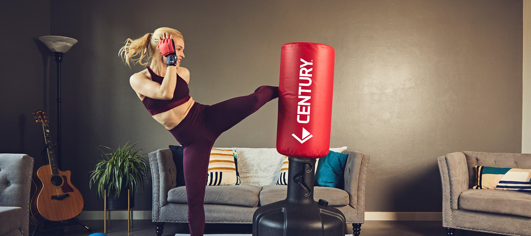 female kicking bob at home