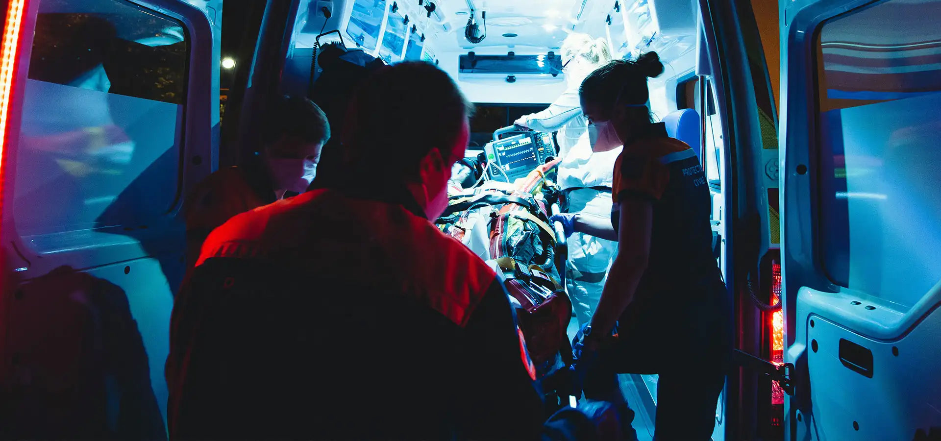 EMT's loading patient into Ambulance