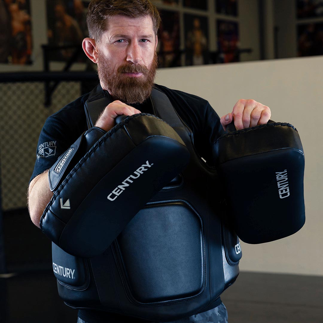 MMA fighter holding Creed gear