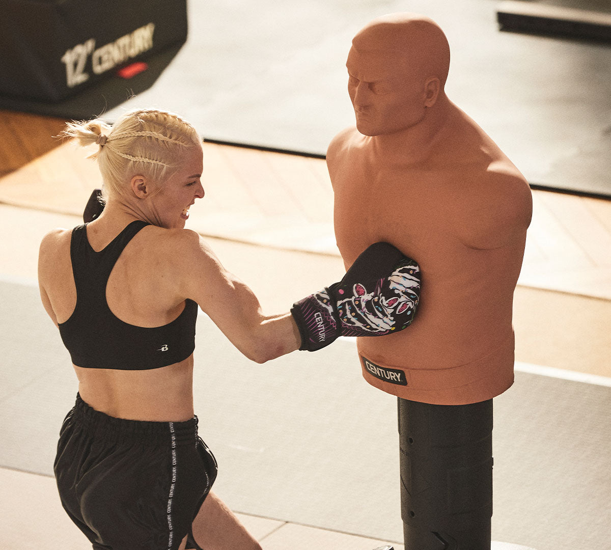 woman punching training bag bob