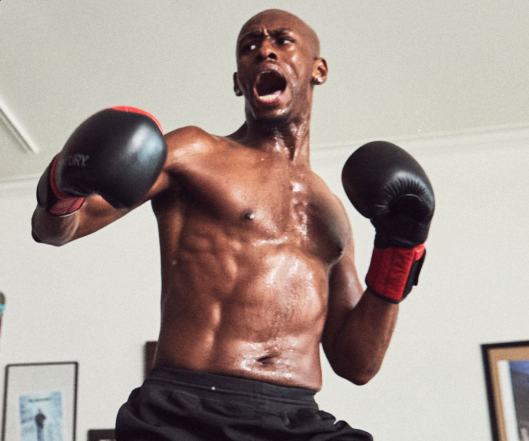 boxer training with boxing gloves